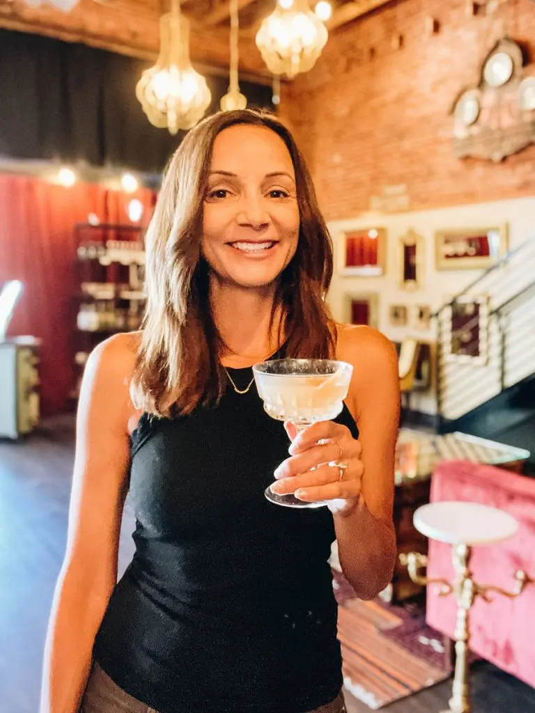 Annette with a cocktail at Backwards Distillery