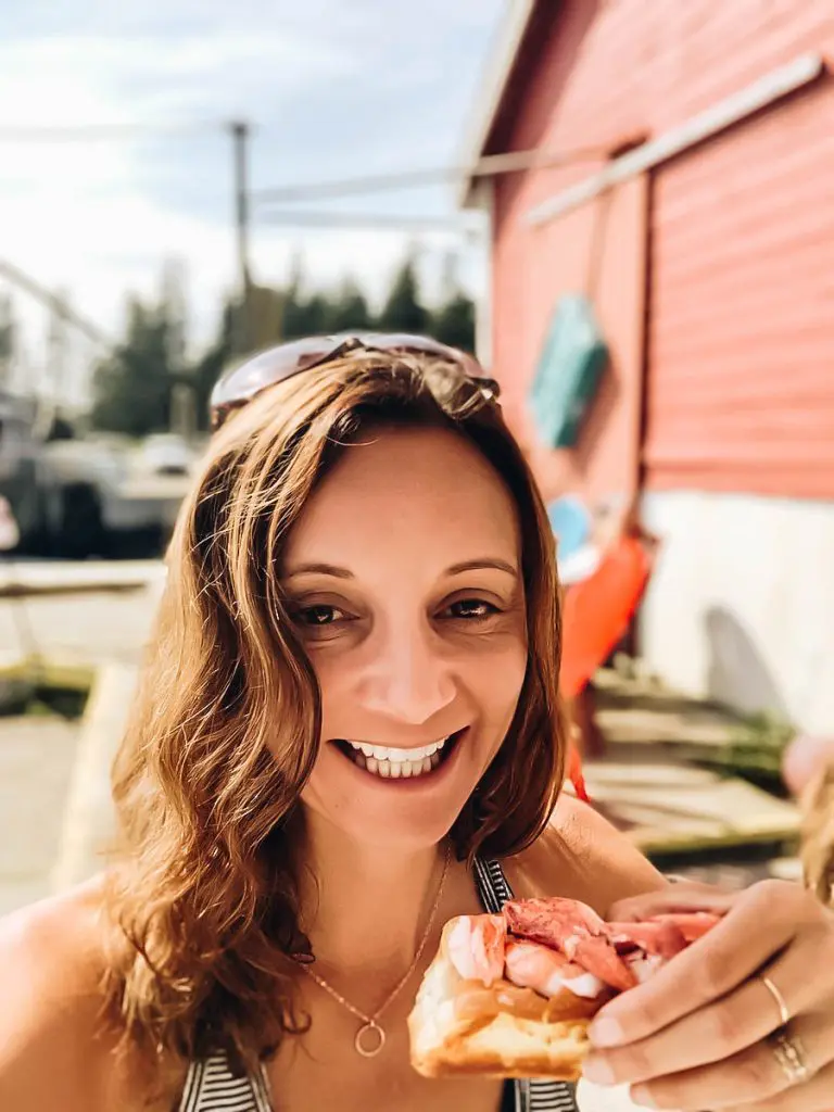 Annette eating Lobster Roll in Maine