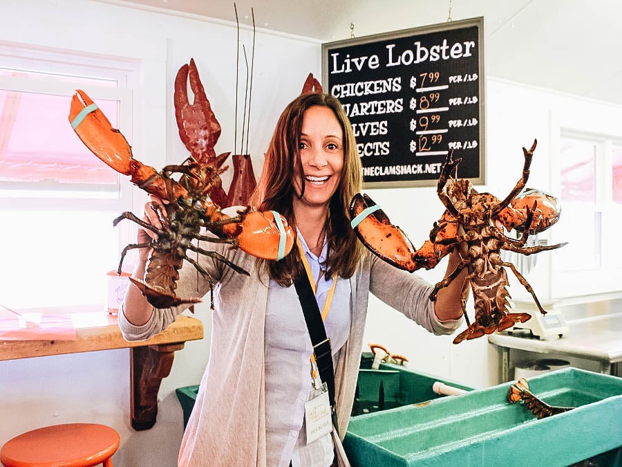 Annette holding two lobsters