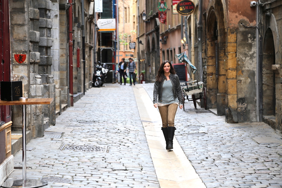 Annette White walking through the old town of Lyon, France