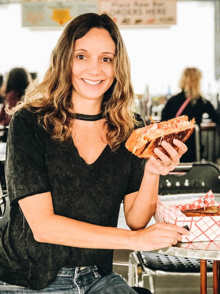 Annette White eating the Lobster Reuben in Key West Florida