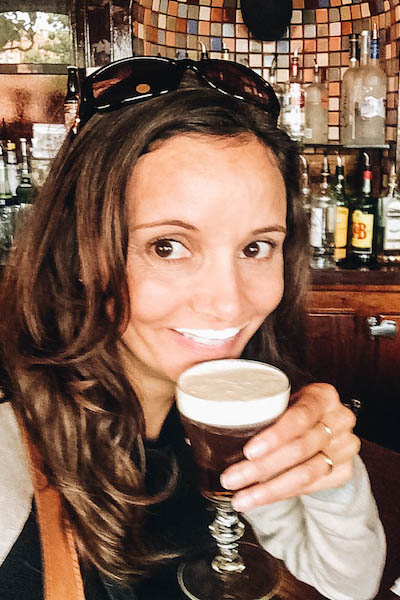 Annette White drinking Irish Coffee at The Buena Vista in San Francisco