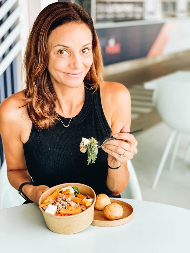 Annette eating a poke bowl