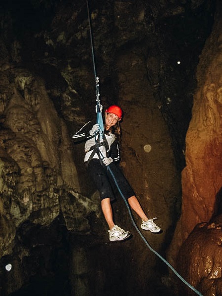 Annette Rappeling into a Cave