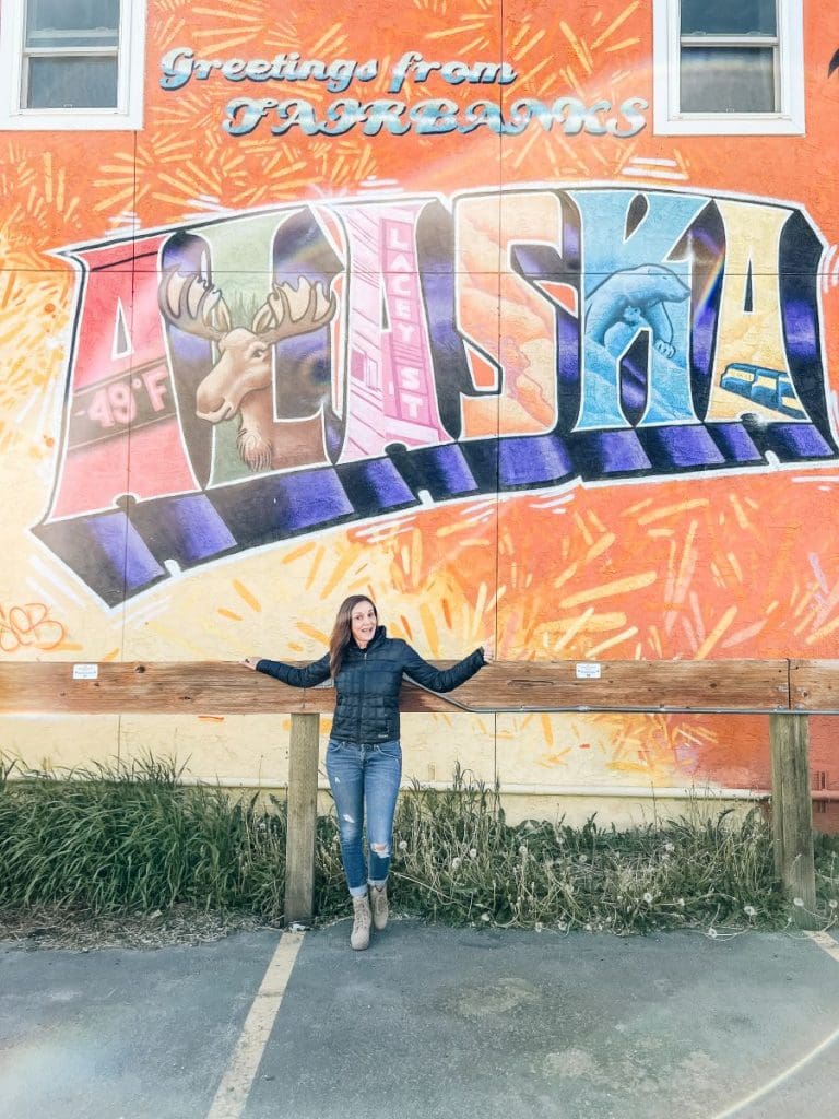 Annette in front of an Alaska Street Art at Fairbanks