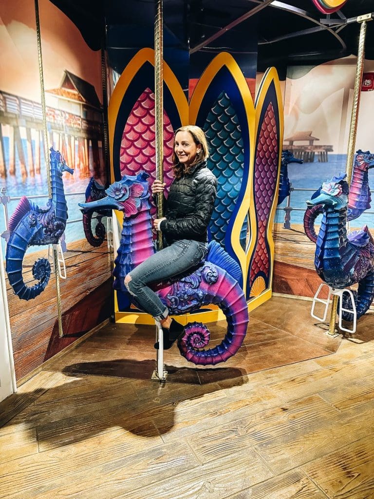 Annette riding a seahorse on Branson Aquarium