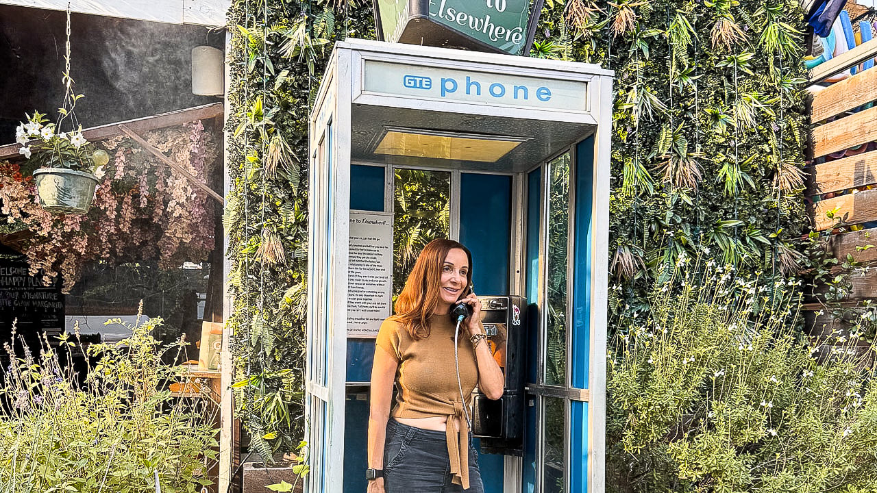 women on a pay phone