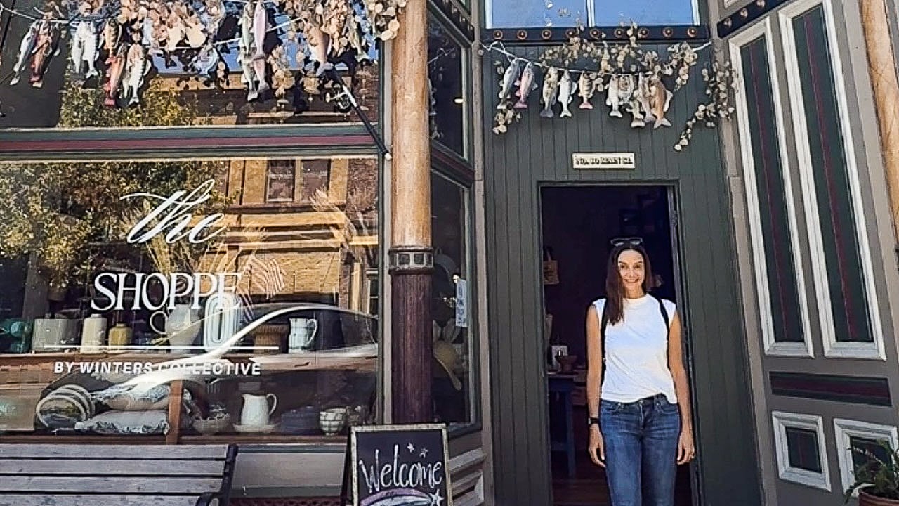 women standing in front of a shop