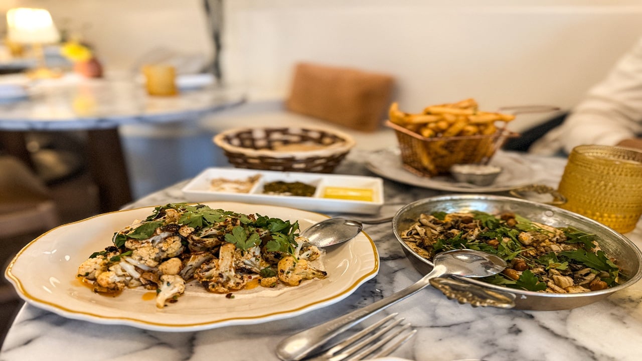 Two plate of mediterranean food on a table